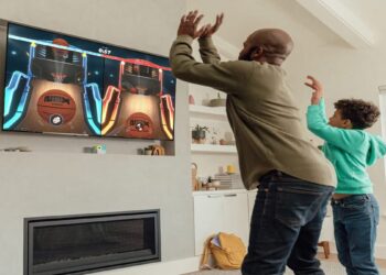 NEX Playground image of a father and son shooting basketballs.